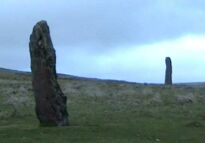 Two of the menhirs at Drizzlecombe, Dartmoor, Devon. Frame capture from a video filmed in April 2003 (28 KB)
